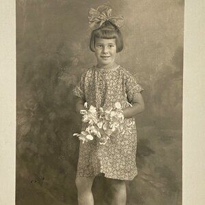 RPPC 1920s Young Swiss Girl Holding Flowers Bouquet Real Photo Postcard